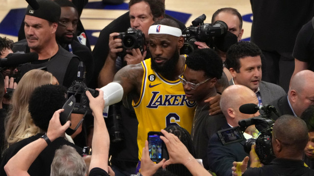 Los Angeles Lakers forward LeBron James (6) hugs his son after becoming the all time highest scoring player in NBA history